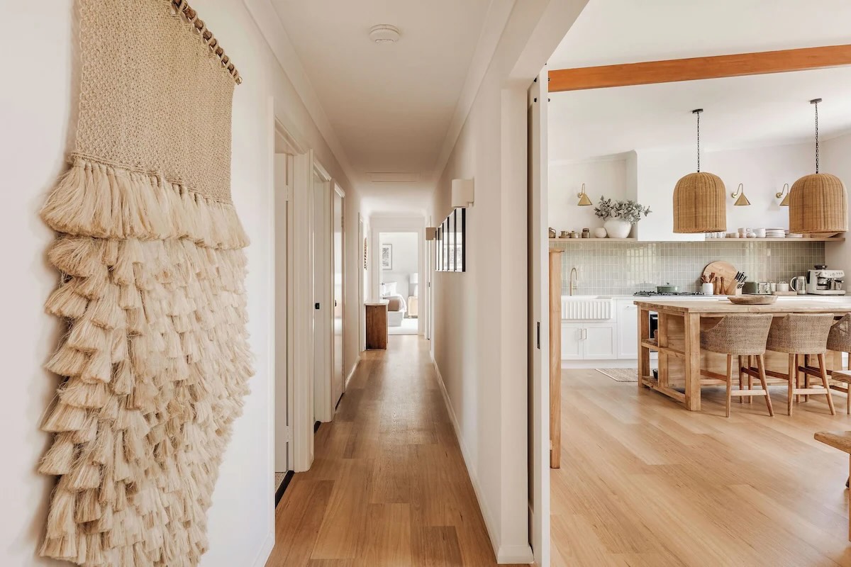 Modern hallway leading to cozy kitchen area